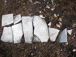 This beautifully hand-crafted marble tombstone, broken into several pieces, is currently receiving professional restoration and will be returned to its original site in the fall of 2008.